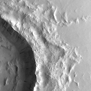 Dark slope streaks on crater rim (THEMIS_IOTD_20140930)